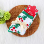 Christmas-themed fluffy socks with festive patterns, tied with elegant ribbon bows, in red, green, and white colors.