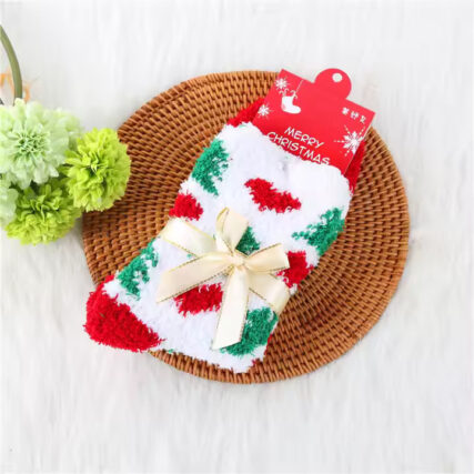 Christmas-themed fluffy socks with festive patterns, tied with elegant ribbon bows, in red, green, and white colors.