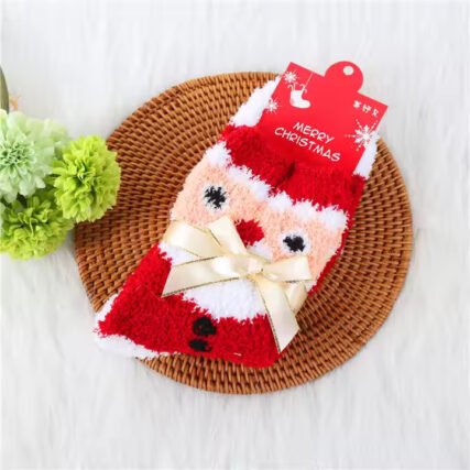 Christmas-themed fluffy socks with festive patterns, tied with elegant ribbon bows, in red, green, and white colors.