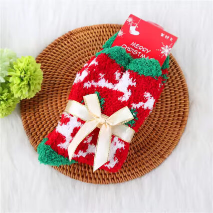 Christmas-themed fluffy socks with festive patterns, tied with elegant ribbon bows, in red, green, and white colors.